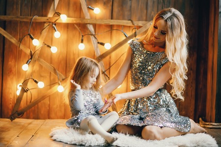 mother and daughter in the holiday spiritの写真素材