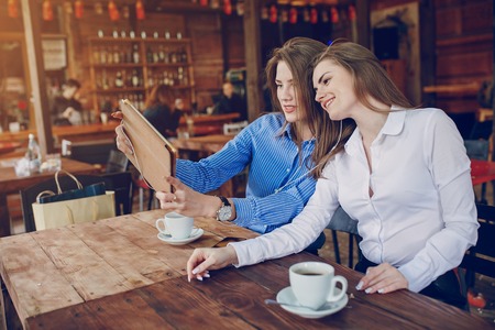 two girls in a cafeの写真素材