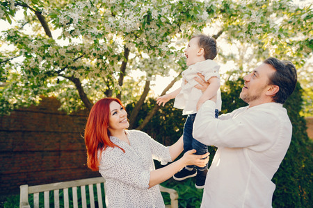cute family in a sunny parkの写真素材