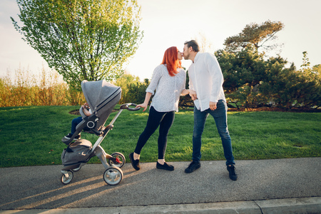 cute family in a sunny parkの写真素材