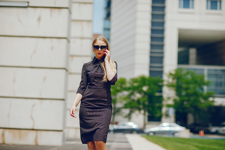 businesswoman in a summer cityの写真素材