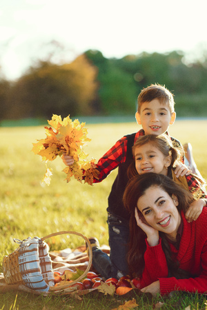 Beautiful mother with little kidsの写真素材