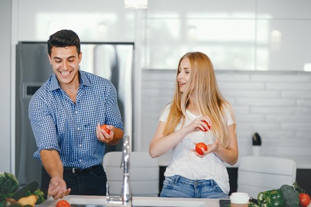couple at home in a kitchenの写真素材