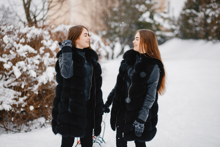 Girls in a winter parkの写真素材