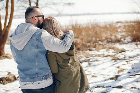 Elegant couple in a winter parkの写真素材