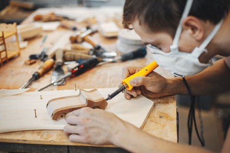 The carpenter works with a treeの写真素材