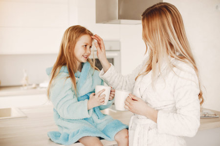 mother with cute blond daughterの写真素材