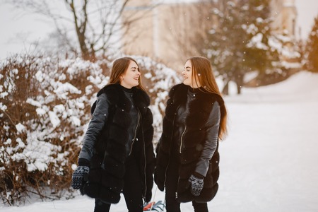 Girls in a winter parkの写真素材