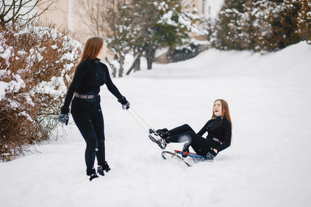 Girls in a winter parkの写真素材