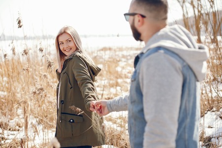 Elegant couple in a winter parkの写真素材