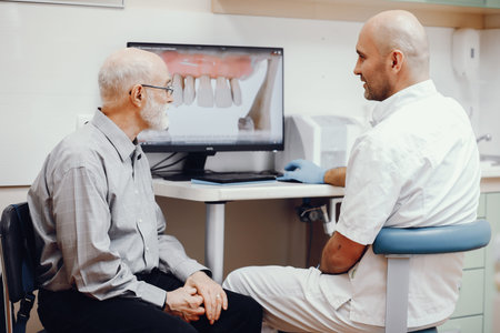 Old man sitting in the dentists office