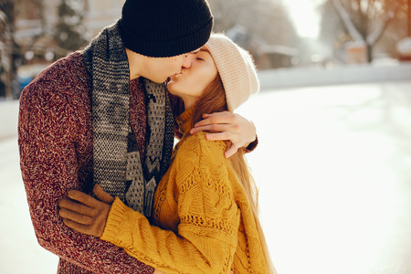 Cute couple in a ice arenaの写真素材