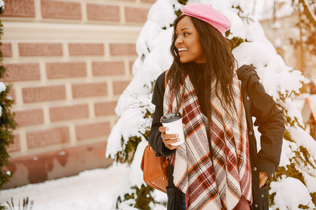 Elegant black girl in a winter cityの写真素材
