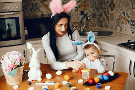 Mother with little son in a kitchen