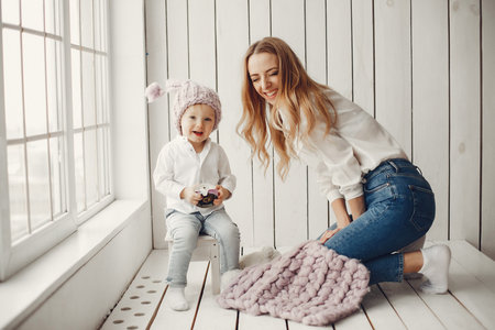 Mother with little son in a room