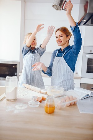 mother with daughter in the kitchenの写真素材