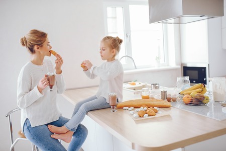 mother with cute blond daughterの写真素材