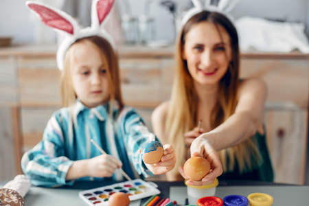 Mother with little daughter in a kitchenの写真素材