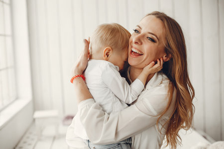 Mother with little son in a room