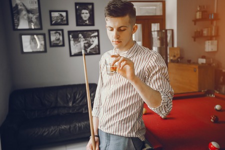 A nice guy playing a billiardの写真素材