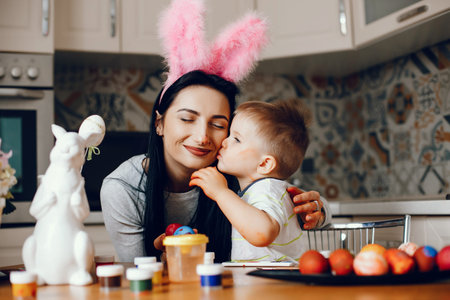 Mother with little son in a kitchen