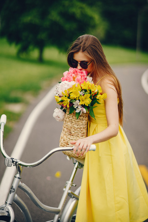 pretty girl with bicycleの写真素材