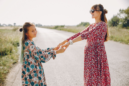 Cute and stylish family in a summer fieldの写真素材