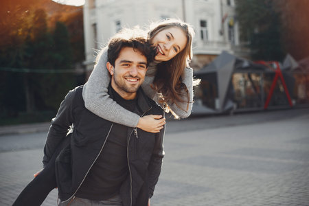 Beautiful couple spend time in a summer city
