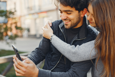 Beautiful couple spend time in a summer cityの写真素材