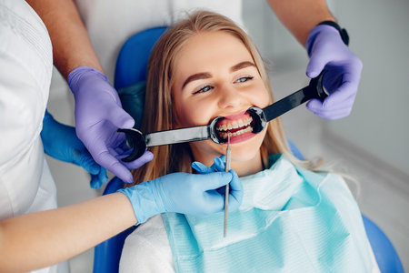 Beautiful girl sitting in the dentists office