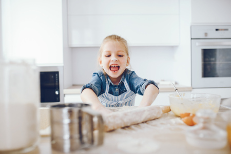 little girl in a kitchenの写真素材