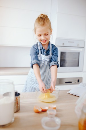 little girl in a kitchenの写真素材