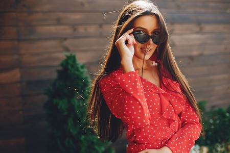 Elegant brunette in a summer cityの写真素材