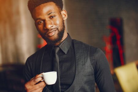 businessman is drinking a coffeeの写真素材