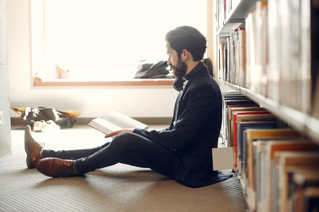 Handsome guy study at the libraryの写真素材