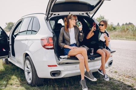 Cute and stylish family in a summer fieldの写真素材