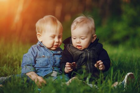 children in the grassの写真素材
