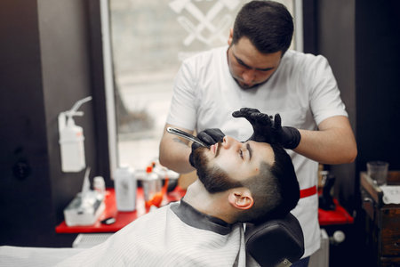 Stylish man sitting in a barbershop