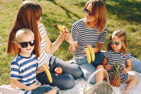 Mothers with kids playing in a summer park