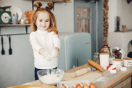 Little boy cook the dough for cookiesの写真素材