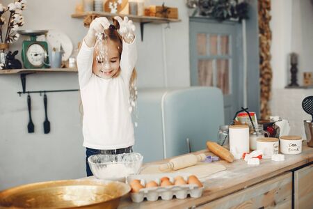 Little boy cook the dough for cookiesの写真素材