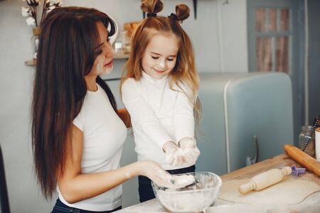 Family cook the dough for cookiesの写真素材