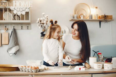 Family cook the dough for cookiesの写真素材