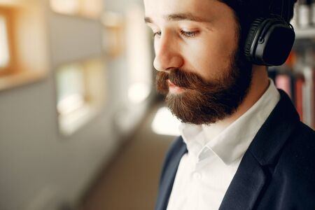 Handsome guy study at the libraryの写真素材