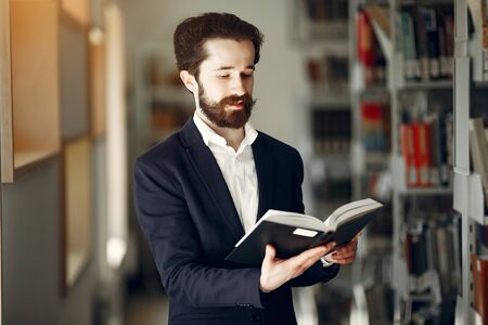 Handsome guy study at the libraryの写真素材