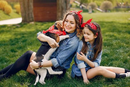 Cute and stylish family in a spring parkの写真素材