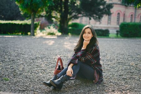 stylish girl walking through the cityの写真素材