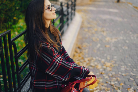 stylish girl walking through the city