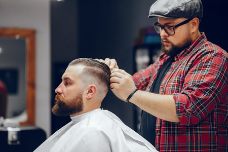 Stylish man sitting in a barbershop