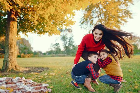Beautiful mother with little kidsの写真素材